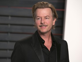 US actor and producer David Spade poses as he arrives to the 2016 Vanity Fair Oscar Party in Beverly Hills, California on February 28, 2016. AFP / ADRIAN SANCHEZ-GONZALEZ