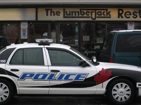 A Windsor police cruiser sits parked in front of the The Lumberjack Restaurant in this file photo. (DAX MELMER/The Windsor Star)