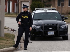 OPP Constable Karen Sinnaeve watching for distracted drivers on McNorton Street and St. Thomas Cres. Monday March 14, 2016. (NICK BRANCACCIO/Windsor Star)
