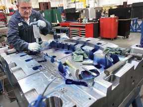 WINDSOR, ON. MARCH 17, 2015. Chris Dietrich an employee of Aalbers Tool and Mold Inc. is shown March 17, 2015, at the Oldcastle, ON. business. The "booming" auto industry has prompted the company to spend $10 million on new equipment and the hiring of an additional 33 people. (DAN JANISSE/ The Windsor Star) (For story by Grace Macaluso)