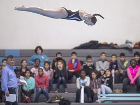 Local diver, Lyric Marshall, 15, performs a dive for students from Immaculate Conception Catholic Elementary School at a press conference announcing that the Windsor Diving Club is officially up and running, at the Windsor International Aquatic and Training Centre, Tuesday, March 1, 2016.