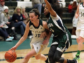 The St. Clair Saints Jaide Lyons cuts around the Lampton College Lions Yasmine Taylor at the St. Clair College SportsPlex in Windsor on Friday, Feb. 5, 2016.
