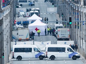 Red Cross tents and police vehicles at the Wetstraat - Rue de la Loi, which was evacuated after an explosion at the Maelbeek - Maalbeek subway station in Brussels. A series of explosions claimed by the Islamic State group ripped through Brussels airport and a metro train Tuesday, killing around 30 people in the latest attacks to bring bloody carnage to the heart of Europe.