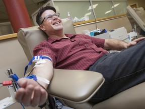 Windsor resident Mike Rogers, 52, gives blood for the 182nd time. Windsor's Canadian Blood Services location was open Friday and Saturday of Easter Weekend, 2016.