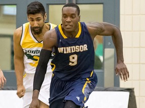 Windsor Lancers forward Alex Campbell dribbles the ball during OUA men's basketball action.
