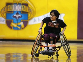 Catholic Central student Carlos Gallega is shown during a wheelchair basketball game at the school on Friday, March 4, 2016 in Windsor, Ont. The game was a fundraiser to help him join a local team.