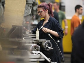 Employees at Centerline Ltd. in Windsor, Ont. are shown on March 31, 2016. A media conference was held at the company to announce government funding for pre-apprenticeship programs in the metal cutting trades.