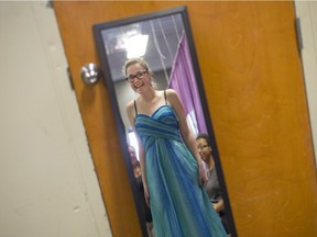 Kayla O'Neil, 17, tries on a prom dress at Say Yes to the Dress at New Beginnings, Saturday, March 19, 2016.