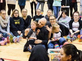 Students gather in the gym at St. Clair College to show their support for World Down Syndrome Day  in Windsor, Ont. on Monday, March 21, 2016. Stephanie Seguin, her husband Mark and their daughters Hazel and Nola visted classes to discuss the stigmas surrounding individuals with Down Syndrome.