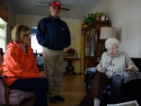 Gene Forbes, 90, right, takes some time to talk with Mayor Ken Antaya and volunteer Beth Piet in LeSalle, Ont. on Wednesday, March 23, 2016.