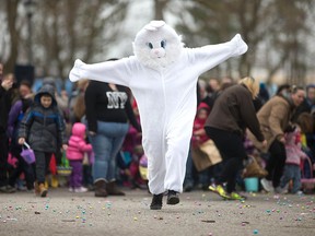Mr. Bunny (Josh Tomes of Breakthrough Walls Christian Church) leads Windsor's "biggest Easter egg hunt ever" at Jackson Park on March 26, 2016.