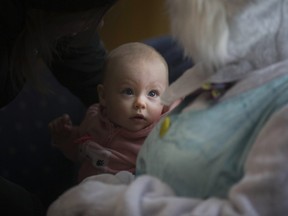 WINDSOR, ON.: MARCH 19, 2016 -- Lyla Nenadovich, 7 months, meets the Easter Bunny at Easter in the Village at the Safety Village, Saturday, March 19, 2016.  (DAX MELMER/The Windsor Star)