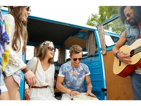 Friends playing music out of minivan. Photo by fotolia.com.