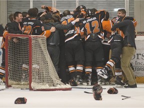 The Essex 73's celebrate after defeating the Amherstburg Admirals in Game 7 of the Great Lakes Junior C hockey final on March 20, 2016.