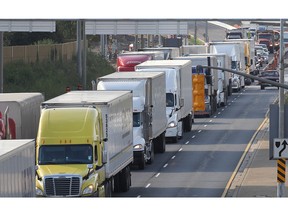 In this file photo, it was bumper to bumper truck traffic in the northbound lane of Huron Church Road as traffic was backed up south of E.C. Row as a delay at the Ambassador Bridge caused headaches for motorists, Sept. 11, 2015. (DAN JANISSE/The Windsor Star)