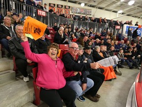 Mary and Rick Watson along with Essex 73's fans celebrate a first period 73's goal against the Amherstburg Admirals on March 15, 2016 in Essex, Ont.