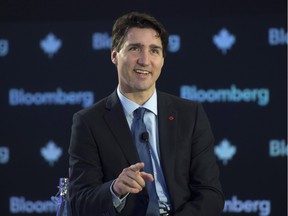 Canadian Prime Minister Justin Trudeau smiles as he responds to a question from the audience during a televised interview in New York, Thursday March 17, 2016.