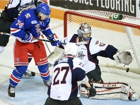 Kitchener Rangers forward Connor Bunnaman scores what turned out to be the winning goal in the third period against Windsor goalie Mario Culina.