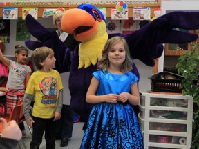 Kamilla Merrow, front right, a student at Sacred Heart Elementary in LaSalle, poses with Youcan the Toucan and other students during a ceremony Friday March 11, 2016.  Merrow won a naming contest from over 200 entries.