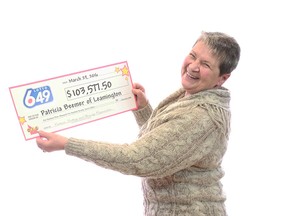 Patricia Beemer of Leamington holds up her prize cheque from the OLG.