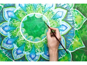 Painting bright green and blue colours of circle pattern. Photo by fotolia.com.