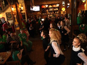 Members of the Emerald Isle Dance Society performing at the Rock Bottom Bar & Grill on Saint Patrick's Day 2014.