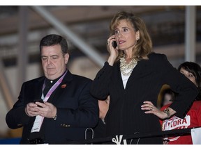 In this file photo, Sandra Pupatello, right, talks on her phone next to Ontario Finance Minister Dwight Duncan, left, as they wait for the voting results at the Ontario Liberal Leadership convention in Toronto on Saturday, Jan. 26, 2013.