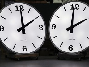 Two six-foot-tall clocks, built for the Florida hospital, are tested prior to shipment at the Electric Time Company in Medfield, Mass., Thursday, March 10, 2016. Most North Americans will lose an hour of sleep this weekend, but gain an hour of evening light for months ahead, as Daylight Saving Time returns this weekend. The time change officially starts Sunday at 2 a.m. local time.