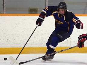 Mitchell Chittle of the St. Anne Saints skates with the puck during WECSSAA high schoo hockey action on Tuesday, Jan. 12, 2016 in Tecumseh, Ont.