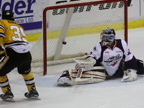 Sarnia Sting forward Nikita Korostelev scores his 19th goal of the season against Windsor Spitfires goalie Mario Culina on Friday March 4, 2016 in Sarnia, Ont.