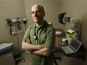 Dr. John Day is photographed in his Tecumseh office on Friday, April 15, 2011.