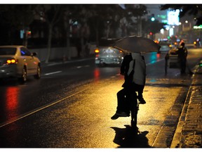 Two people riding a bicycle at night. Photo by fotolia.com.