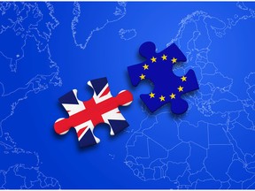 United Kingdom and European Union puzzle pieces on blue background. Image by fotolia.com.