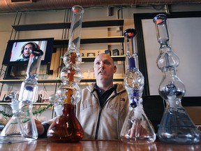 Leo Lucier shows off some bongs at his newly opened Vapelated Vapor Lounge at 26 Chatham St. E. in downtown Windsor, March 16, 2016.