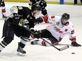 The LaSalle Vipers Liam MacDougall cuts around the Leamington Flyers David Storey at the Vollmer Centre in LaSalle on Wednesday, Feb. 17, 2016.