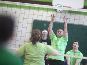 Members of the Windsor Police Service compete against teachers in a friendly game of volleyball for Clovers for Camp, at Dr. David Suzuki Public School, Friday, March 11, 2016.  Each student paid $1 to watch the volleyball action with the money going towards Camp Brombal, the Windsor police summer camp for kids.  A total of $425 was raised.