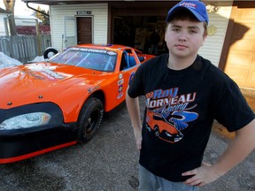 Street Stock race car driver Ray Morneau is pictured in front of his car on Feb. 2, 2015.