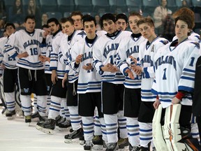 The Villanova Wildcats wait for their silver medals after losing 4-0 to Peterborough St. Peter Saints during the gold-medal game in boys' AAA OFSAA hockey at the Vollmer Complex in LaSalle on March 10, 2016.