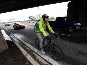 Cyclist Stephen Pitman braves the underpass on Dougall Avenue in Windsor on March 28, 2016. Pitman often uses the route to makes his way downtown and he is hoping the city will add some measures to make the area safer for cyclists.