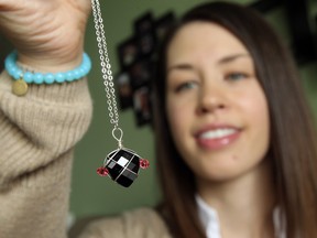 Courtney Fitzpatrick displays her jewelry at her home in Windsor on March 4, 2015. Fitzpatrick, who has endometriosis, has created jewelry in the shape of a uterus.