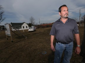 Norbert Bolger of Nor-Built Construction stands next to a lot in Amherstburg he'd like to develop, on March 8, 2016.