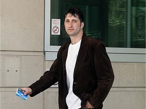 Leke Vushaj leaves a Police Act hearing at the Windsor Police headquarters on March 30, 2009.