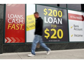 WINDSOR, Ontario.  June 6, 2013. Cheque cashing and payday loans store on Ouellette Avenue at Wyandotte Street in downtown Thursday June 6, 2013. (NICK BRANCACCIO/The Windsor Star)