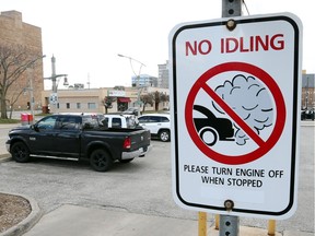 A sign warning motorists not to idle their car is seen at Windsor City Hall in downtown Windsor, Ont., on March 16, 2016.