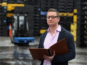 Jeremy Berger of Green Processing Co., takes inventory of plastic industrial containers recently. The local industrial recycling company is expanding even more, this time into Alabama.