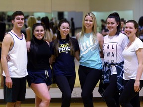 Lancer Competitive Dance Company members Quinton Velcic, from left,  Paige Eddie,  Sam Campbell, Natalie Kindiak,  Rachel Neufert, and  Kate Hatfield take a break during rehearsals at the University of Windsor on March 29, 2016.