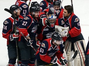 The Windsor Spitfires celebrate the overtime-winning goal by Bradley Latour to beat the Kitchener Rangers in Game 4 of their OHL playoff series at the WFCU Centre in Windsor, Ont., on March 30, 2016.