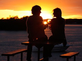 A couple enjoys the sunset while drinking wine at Fort Malden in Amherstburg, Ont. in this file photo.