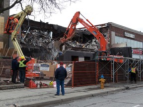 Rudak Excavating demolish the former Vanity Theatre on Ouellette Avenue Monday April 11, 2016. A crew of six will take about one week to complete the task. Expect some short delays for traffic along southbound Ouellette Avenue.