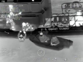 A screen grab from a Coast Guard video shows a rescue in the Detroit River.